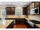 Modern kitchen with granite countertops and stainless steel appliances at 4550 Fernbrook Pl, Cumming, GA 30040