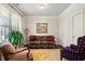 Cozy office with hardwood floors, built-in shelving and window seating at 4550 Fernbrook Pl, Cumming, GA 30040