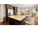 Kitchen with large island, granite countertops, and stainless steel appliances at 4550 Fernbrook Pl, Cumming, GA 30040