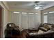 Sunroom with wicker furniture, hardwood floors, and access to a deck at 490 Hill Se St, Atlanta, GA 30312