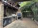 Stone outdoor kitchen with grill, pizza oven, and prep space at 490 Hill Se St, Atlanta, GA 30312