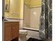 Clean bathroom with shower/tub combo, tile flooring, and wood vanity at 490 Hill Se St, Atlanta, GA 30312