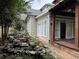 Landscaped side yard with pond, walkway and wooden deck at 490 Hill Se St, Atlanta, GA 30312