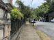 Residential street view with sidewalk and parked cars at 490 Hill Se St, Atlanta, GA 30312