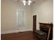 Spacious bedroom with hardwood floors, plantation shutters, and fireplace at 490 Hill Se St, Atlanta, GA 30312