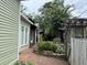 Landscaped side yard with brick walkway and arbor at 490 Hill Se St, Atlanta, GA 30312