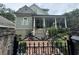 Charming two-story home with ornate gate at 490 Hill Se St, Atlanta, GA 30312