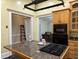 Kitchen with wood cabinets, granite island, and modern appliances at 490 Hill Se St, Atlanta, GA 30312