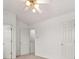 Simple bedroom with neutral walls, carpeting, and multiple doors at 2736 Parkway Trl, Lithonia, GA 30058