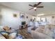 Open living room with wood-look floors and comfy seating at 701 Dove Tree Ln, Social Circle, GA 30025