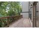 Spacious deck with wooden railings, offering a peaceful wooded view at 1017 Brandsford Nw St, Atlanta, GA 30318