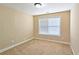 Bright bedroom featuring neutral walls and carpet at 5979 Mayfield View Dr, Tucker, GA 30084