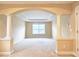 Spacious bedroom with arched entryway and neutral decor at 5979 Mayfield View Dr, Tucker, GA 30084