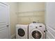 Laundry room with washer, dryer, and shelving at 5979 Mayfield View Dr, Tucker, GA 30084