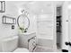 Clean bathroom with a bathtub and a vanity at 6940 Cainwood Dr, Atlanta, GA 30349