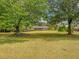 Charming ranch home nestled among mature trees at 1152 Harbins Rd, Dacula, GA 30019