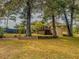 House back view, deck, and partially wooded lot at 1152 Harbins Rd, Dacula, GA 30019