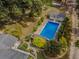 Aerial view of a rectangular pool, with a shed and landscaping at 1152 Harbins Rd, Dacula, GA 30019