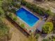 Inviting inground pool with surrounding patio and landscaping at 1152 Harbins Rd, Dacula, GA 30019