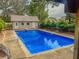 Inviting in-ground pool with diving board; spacious backyard oasis at 1152 Harbins Rd, Dacula, GA 30019