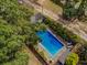 Inviting in-ground pool with surrounding landscaping and a shed at 1152 Harbins Rd, Dacula, GA 30019
