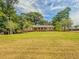 Charming ranch home with large yard and mature trees at 1152 Harbins Rd, Dacula, GA 30019