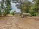 Small guest house with greenhouse and gravel driveway at 1152 Harbins Rd, Dacula, GA 30019