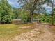 Greenhouse and shed nestled in a wooded area at 1152 Harbins Rd, Dacula, GA 30019