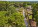 Aerial view showing home, driveway, and surrounding landscape at 1152 Harbins Rd, Dacula, GA 30019