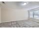 Living room with grey carpet and large windows at 3978 Nations Dr, Douglasville, GA 30135