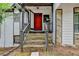 Stone steps leading to a red front door with a covered porch at 288 Omega Dr, Lawrenceville, GA 30044