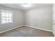 Spacious bedroom with neutral walls and carpet at 1669 Freedom Vly, Decatur, GA 30032