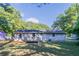 House exterior with backyard, deck, and trees at 1669 Freedom Vly, Decatur, GA 30032