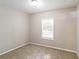 Bright bedroom with neutral walls, carpet flooring, and window with blinds at 1669 Freedom Vly, Decatur, GA 30032