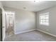 Bedroom with carpet, window, and access to hallway at 1669 Freedom Vly, Decatur, GA 30032