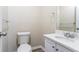 Clean bathroom, white vanity, and new flooring at 1669 Freedom Vly, Decatur, GA 30032