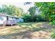 Spacious backyard with lush green grass and mature trees at 1669 Freedom Vly, Decatur, GA 30032