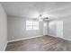 Bright living room featuring gray walls, wood-look floors and ceiling fan at 1669 Freedom Vly, Decatur, GA 30032