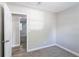 Bedroom with carpet, window, and access to another room at 1669 Freedom Vly, Decatur, GA 30032
