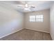 Spacious bedroom with neutral wall color, ceiling fan, and carpet flooring at 1669 Freedom Vly, Decatur, GA 30032