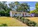 Newly renovated light gray house with red door and landscaping at 1669 Freedom Vly, Decatur, GA 30032