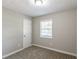 Simple bedroom with neutral walls and carpet at 1669 Freedom Vly, Decatur, GA 30032