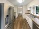 Modern kitchen featuring stainless steel appliances and wood flooring at 3551 Mill Glen Dr, Douglasville, GA 30135