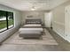 Virtually staged bedroom with a neutral color palette and modern furniture at 3551 Mill Glen Dr, Douglasville, GA 30135