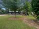 Charming house with a large front yard and mature trees at 3551 Mill Glen Dr, Douglasville, GA 30135