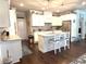 Modern kitchen with white cabinets, granite countertops, and stainless steel appliances at 310 Ellington Dr, Canton, GA 30115