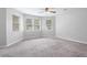 Bedroom with bay window, ceiling fan and carpet flooring at 3274 Forette Ln, Lithonia, GA 30038