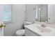 Clean bathroom with white vanity and shower at 3274 Forette Ln, Lithonia, GA 30038