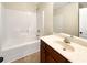 Bathroom with tub, single vanity, and tile flooring at 1437 Bramlett Hill Dr, Lawrenceville, GA 30045