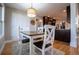 Bright dining area with farmhouse-style table and kitchen view at 5093 Cumberland Ct, Villa Rica, GA 30180